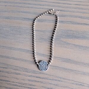 Silver Beaded Bracelet with Floral Medallion